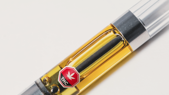 Photo of a cannabis vaping cartridge with a standardized THC symbol.
